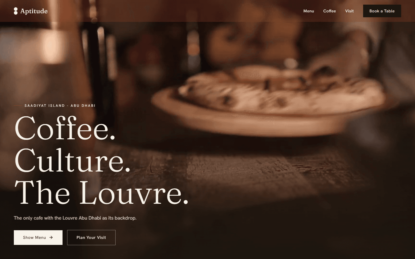 Aptitude cafe homepage with the headline Coffee. Culture. The Louvre.